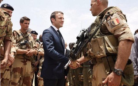 Macron says officer killed in Iraq as pro-Iran group vows to target French interests