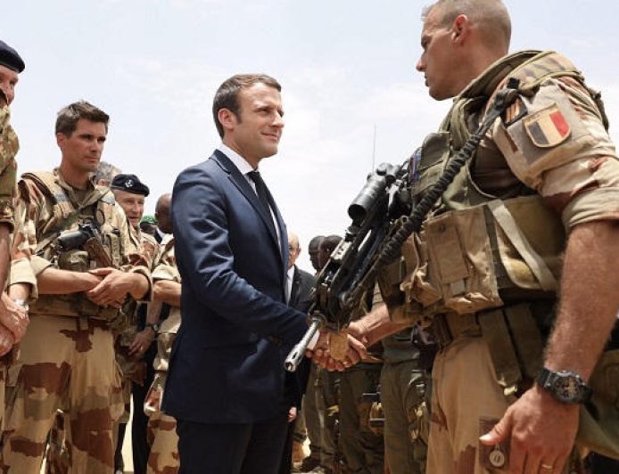 Macron says officer killed in Iraq as pro-Iran group vows to target French interests